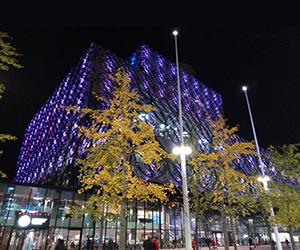 The Library of Birminghan lit up purple