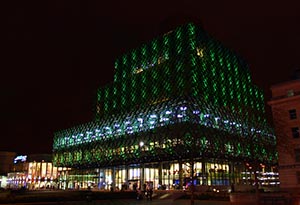Outside of Library of Birmingham lit up in green