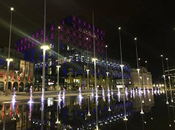 Outside of Library of Birmingham lit up in pink and blue.