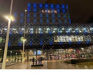 Image of Library of Birmingham lit up light blue