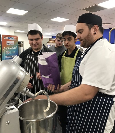 The hive students preparing fresh bread